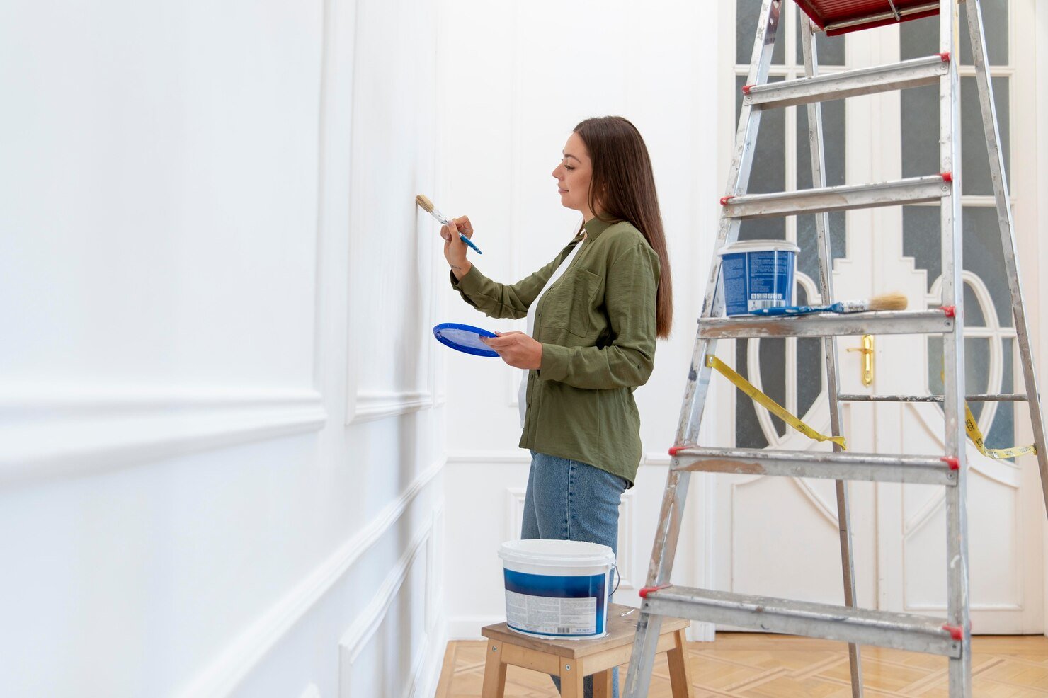medium-shot-woman-painting-wall-home_23-2149098981